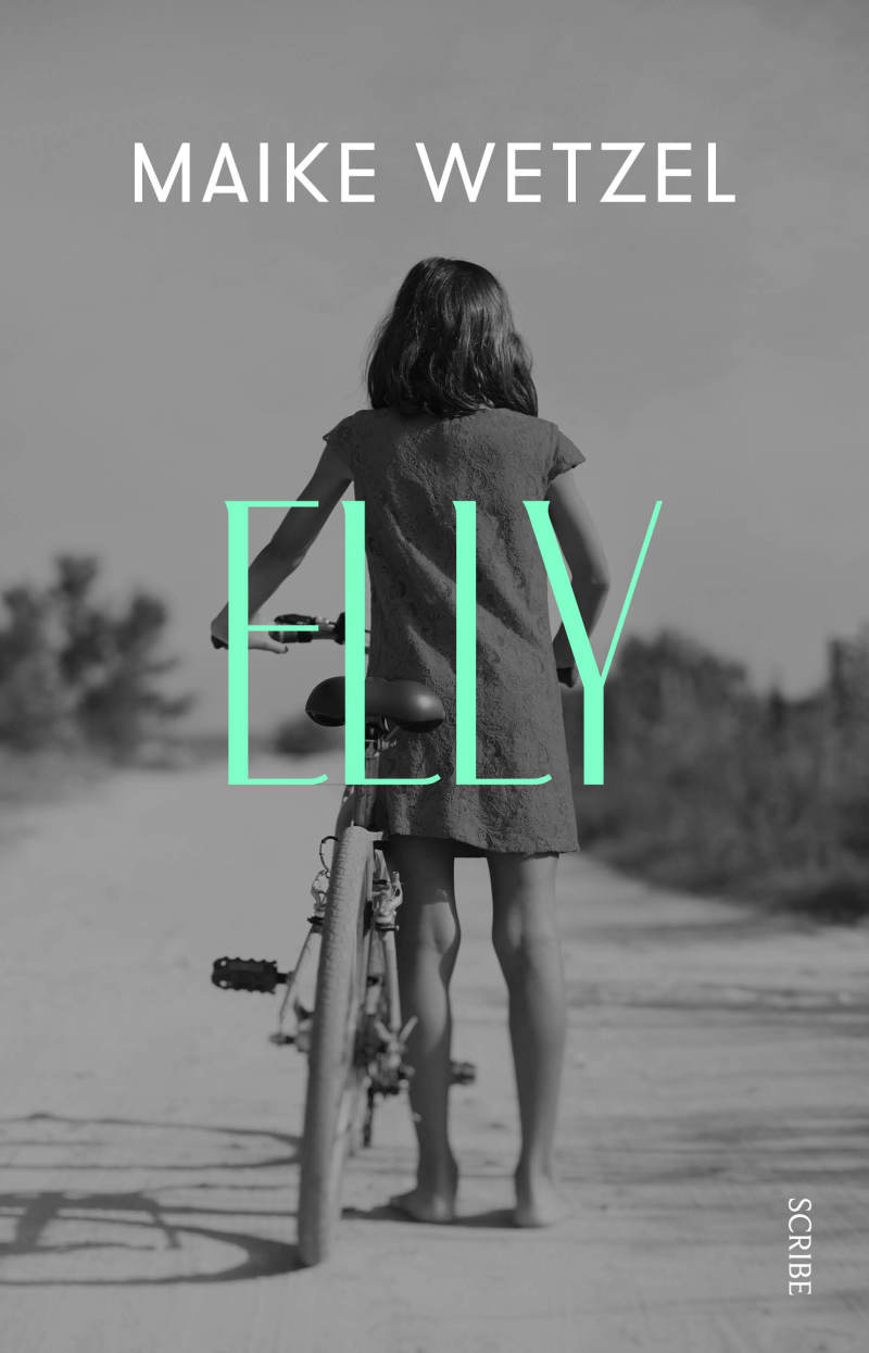 Reverse of young girl on a bike in the road