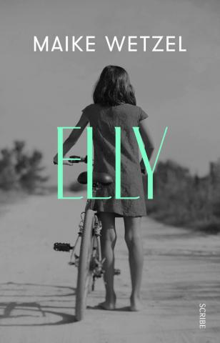 Reverse of young girl on a bike in the road